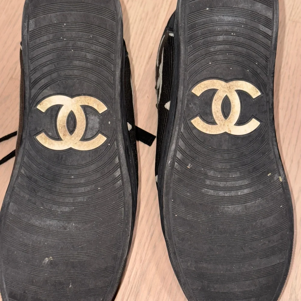 CHANEL Black High-Top Sneakers with Star Design